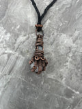 Copper Wire-Wrapped Hand Holding Clear Quartz Necklace